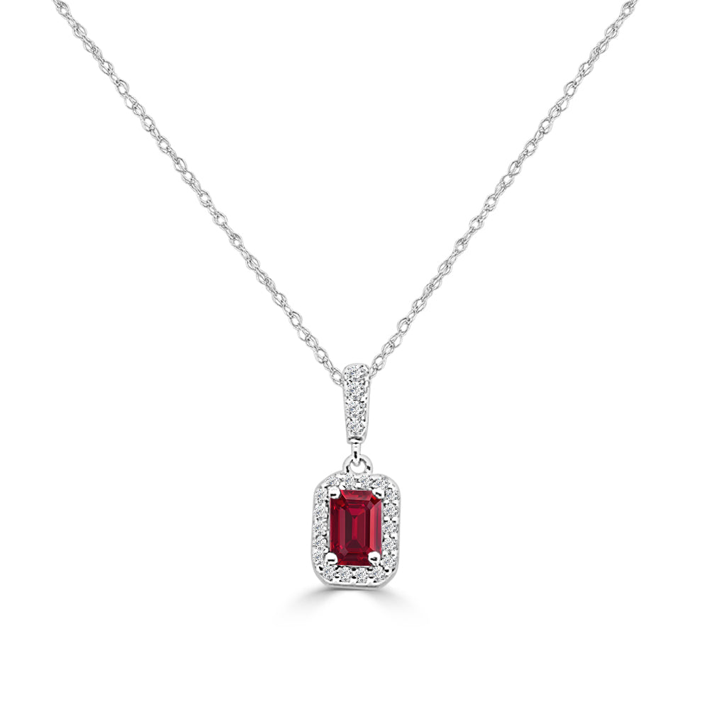 14 Karat White Gold Emerald-Shaped Ruby With Diamond Halo Necklace - 0.70 Carats