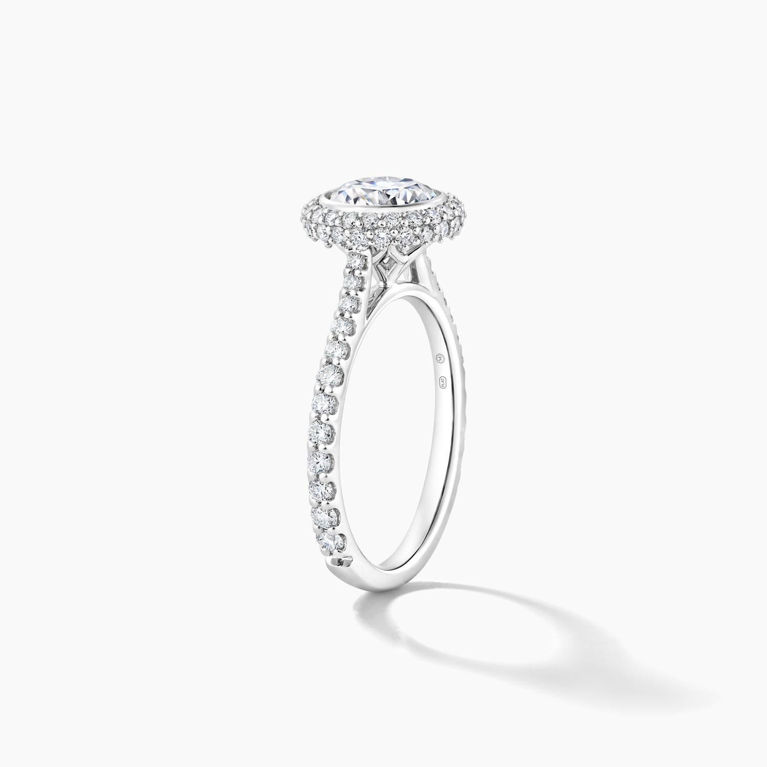 Platinum Bezel Set with Pave Halo Engagement Mounting and Diamond Band