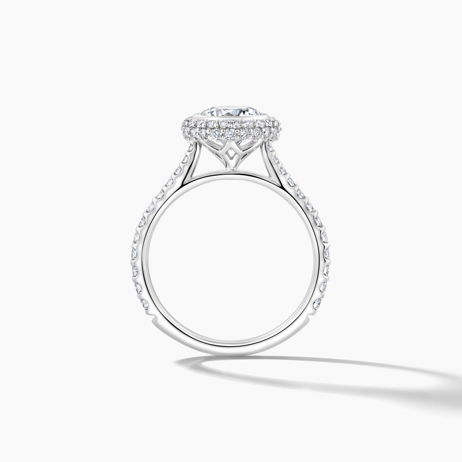 Platinum Bezel Set with Pave Halo Engagement Mounting and Diamond Band