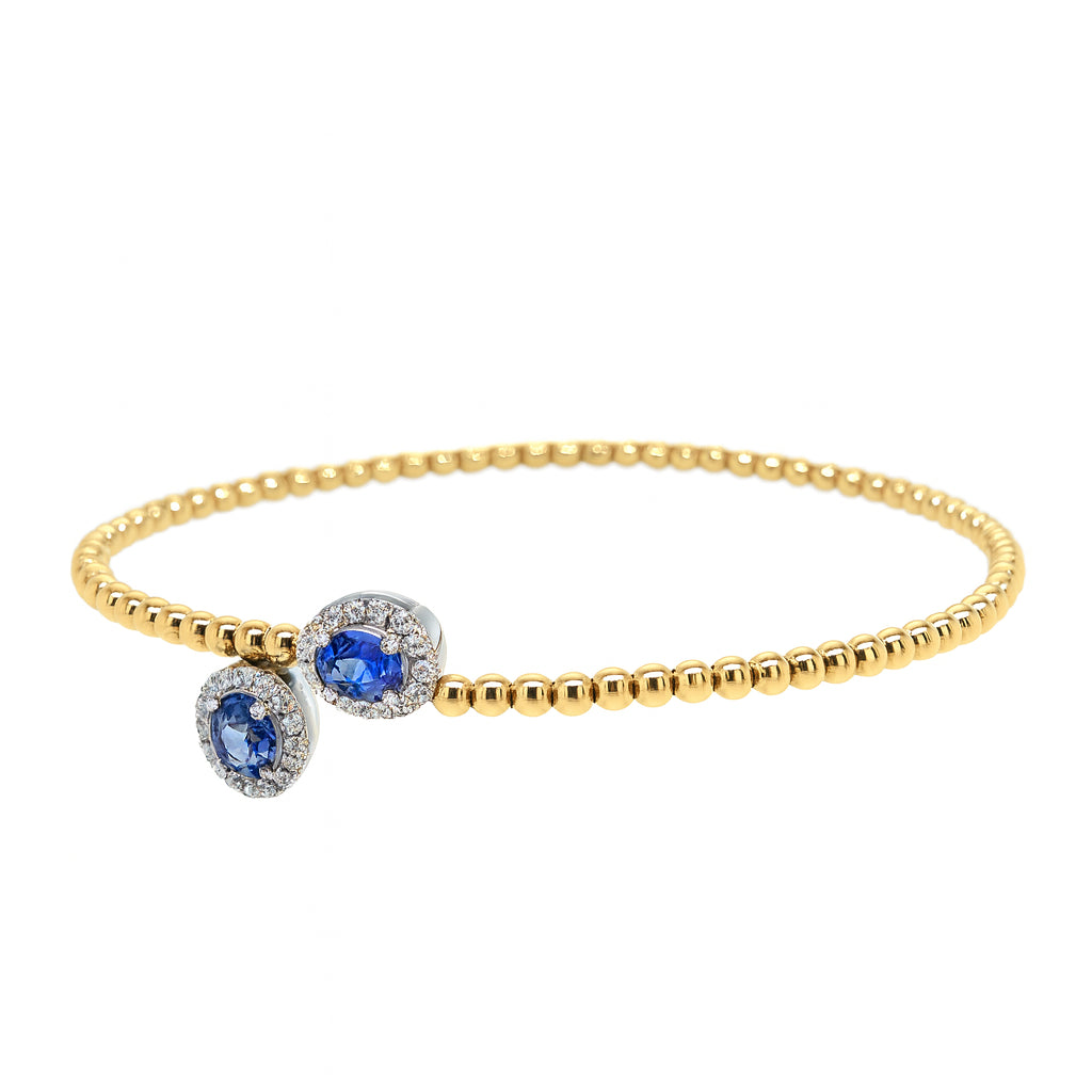 Dazzling Diamond and Sapphire Wrap Bangle in 14 Karat Two-Tone Bracelet with Blue Sapphire Oval Shape - 1.07 Carats