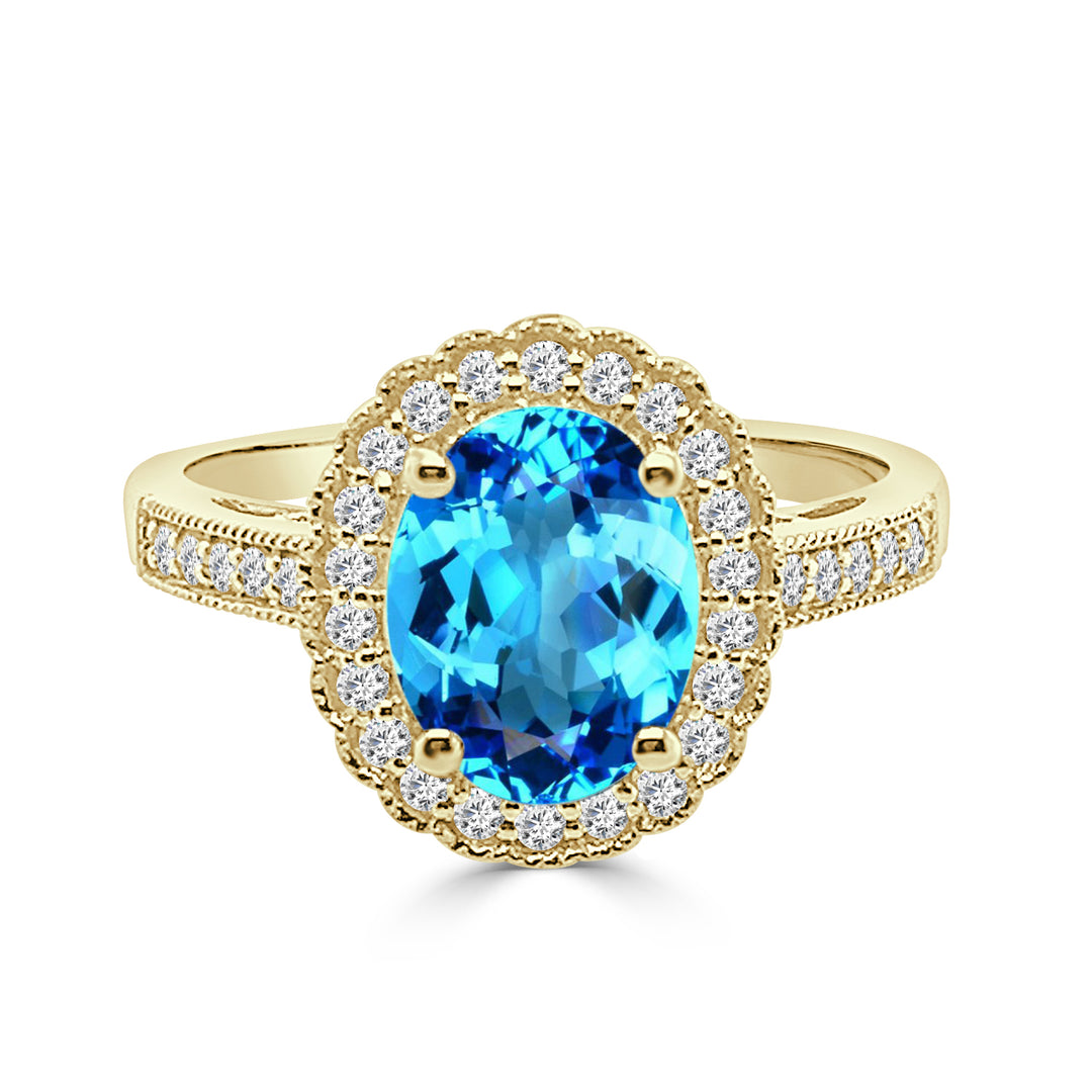 14 Karat Yellow Gold Ring with Blue Topaz in a Unique Shape