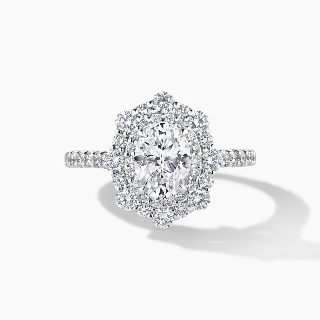 Exquisite Platinum Engagement Mounting with SMP Oval Double Halo and Diamond Band