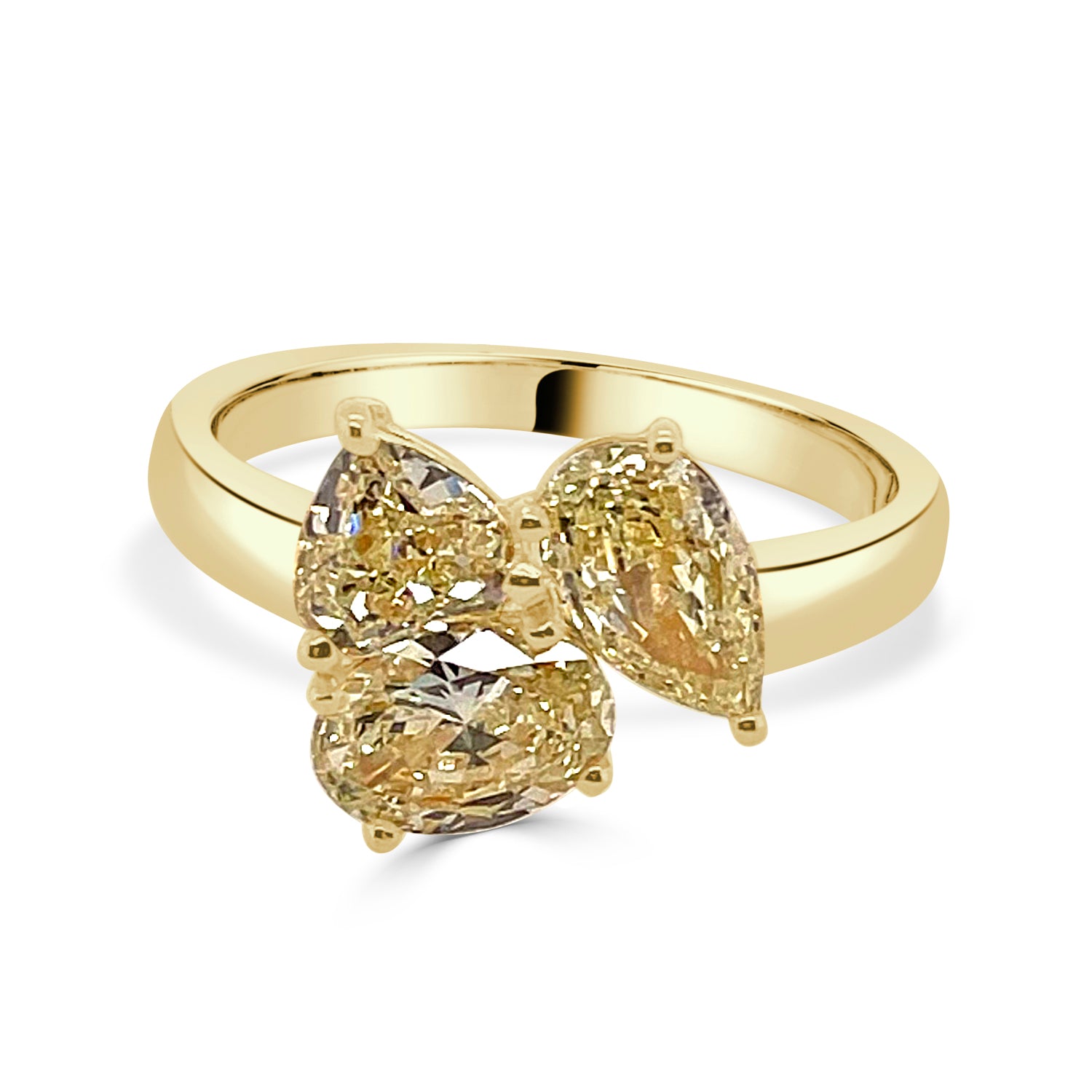 Oval Pear and Trillion Three Stone Ring in 18 Karat Yellow Gold with a 2.12 Yellow Diamond