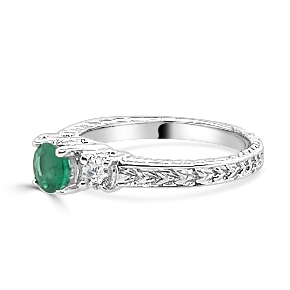 Exquisite Trio: Round Emerald and Diamond Three Stone Ring in 14 Karat White Gold