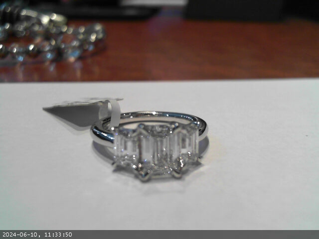 Sure! How about this product title: 14 Karat White Gold Lab Diamond Emerald Shape Engagement Ring - 1.52 Carats