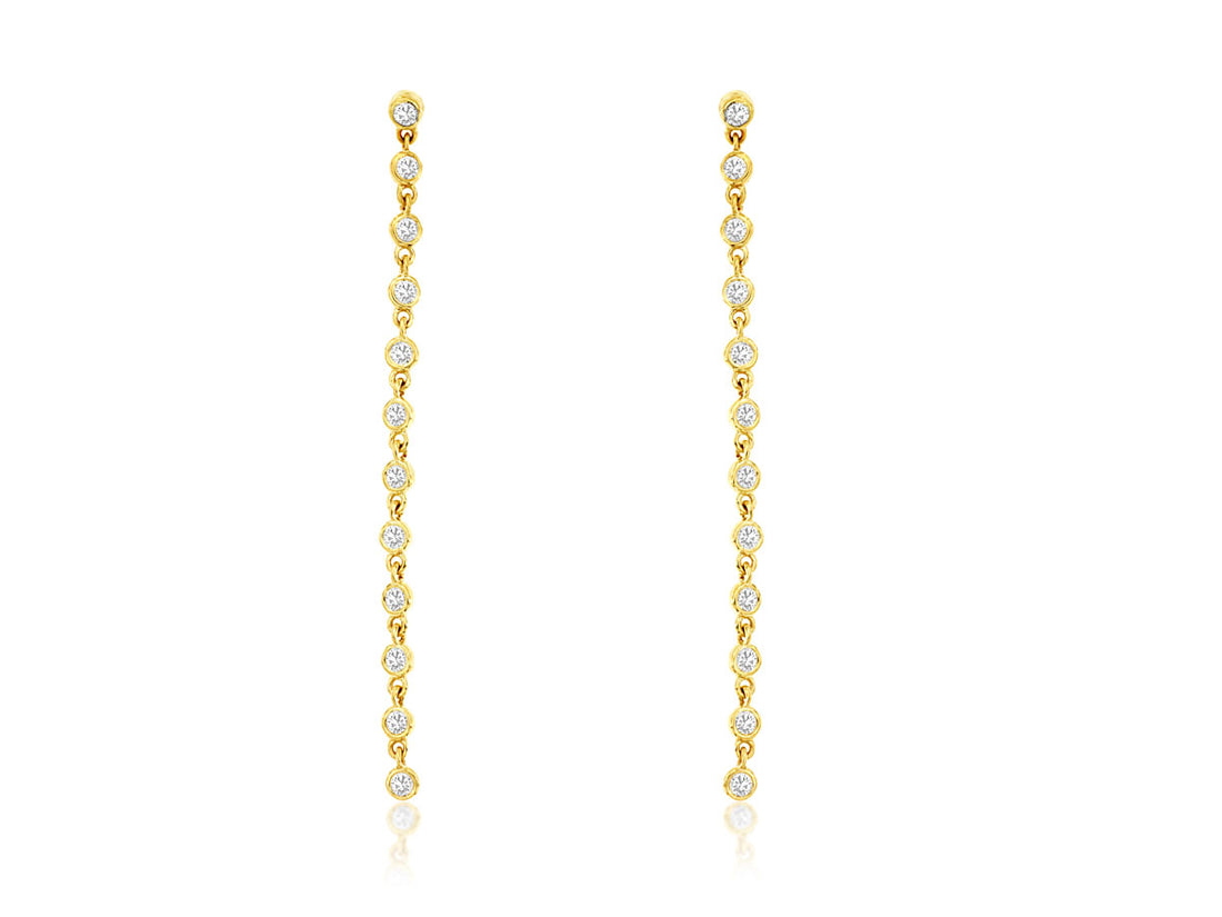 Sure! How about 14K Yellow Gold Long Bezel Set Diamond Earrings (0.50 ct)?